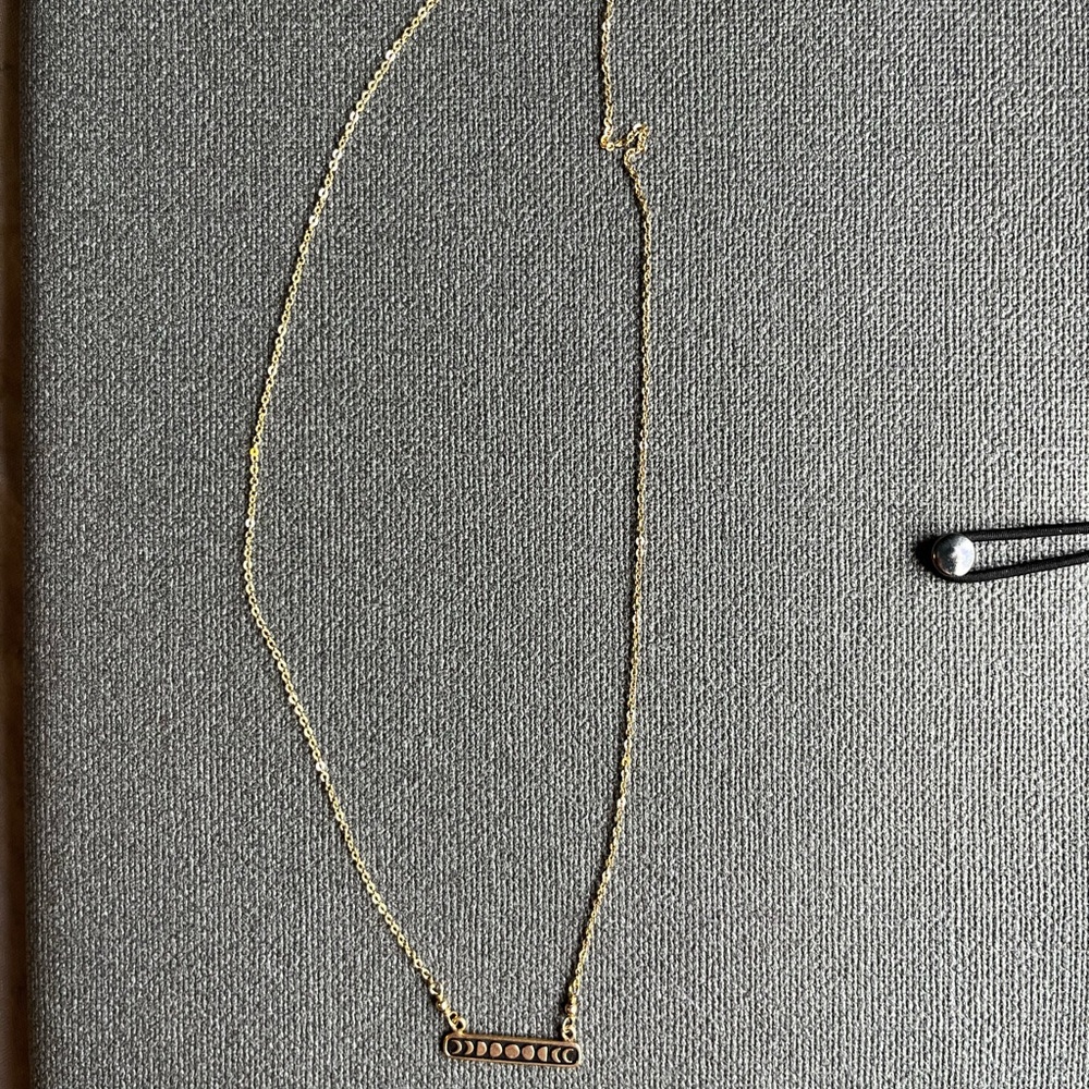 Boutique gold tone moon phases necklace